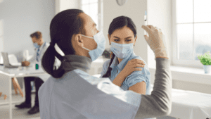 Photo of medical professional administering injection
